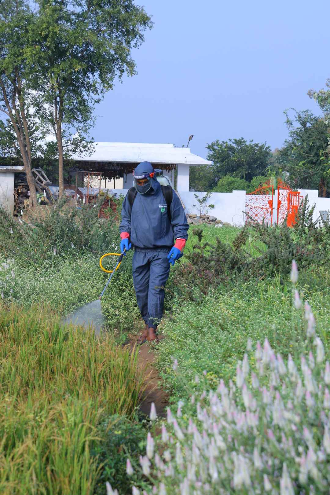 Indian farmer wearing Kisan Kavach suit in farmland